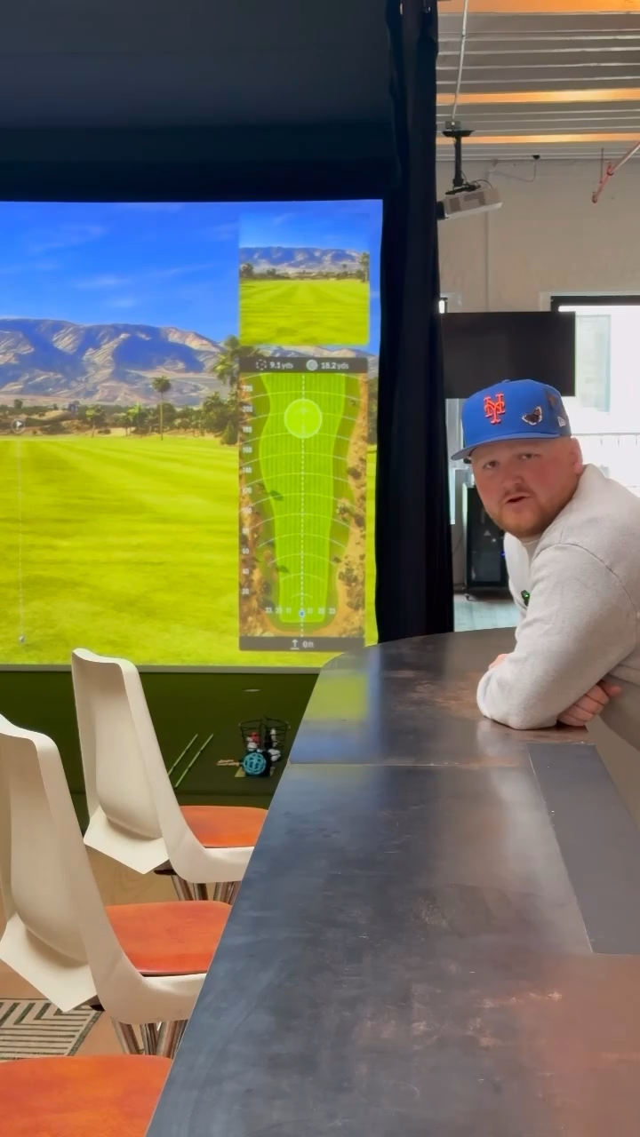 Club counter area with simulator in background